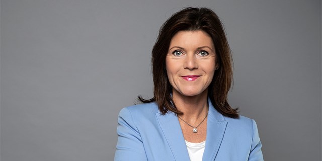 Porträtt av Eva Nordmark i ljusblå kavaj.
